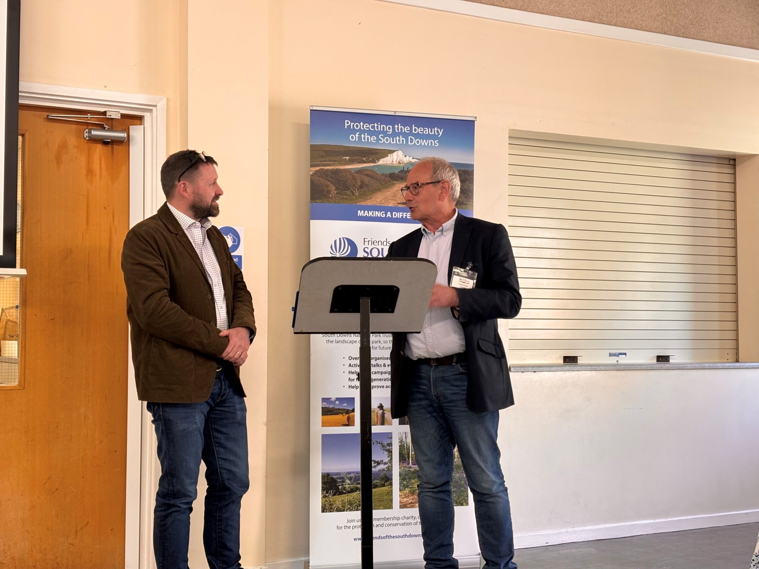 The Chief Executive of the South Downs National Park Authority in discussion with the Chairman of the Friends of the South Downs.