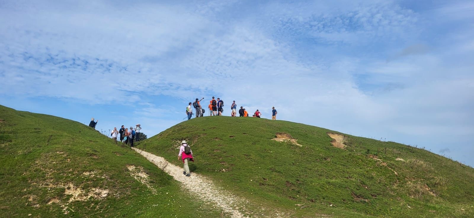 Walkers atop a mount on the South Downs.