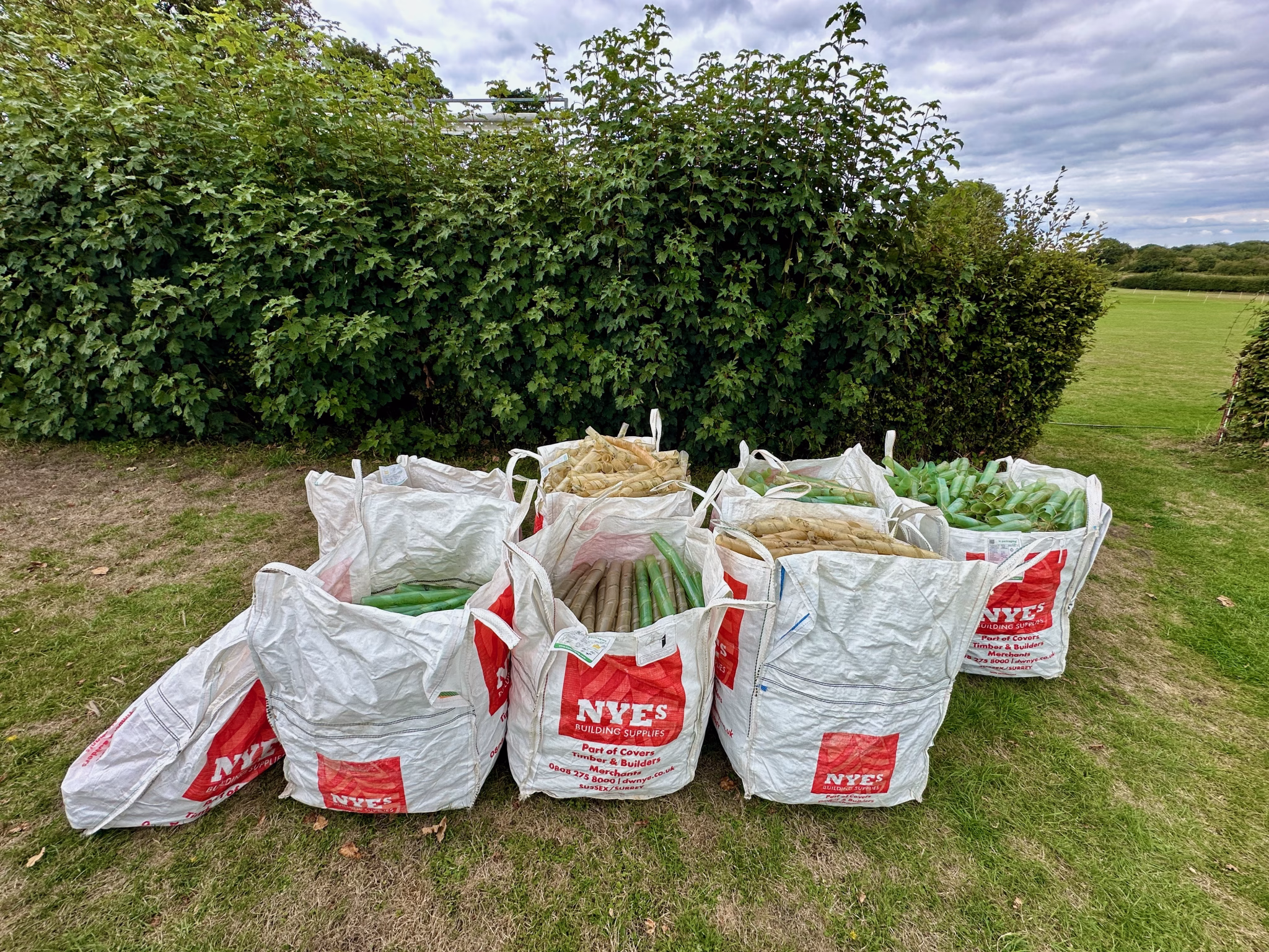 Bags of collected redundant plastic tree guards. 